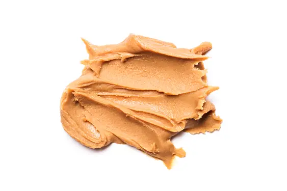 Close-up of xylitol-free peanut butter on a white background
