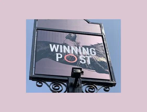 Pub sign that says 'winning post'.