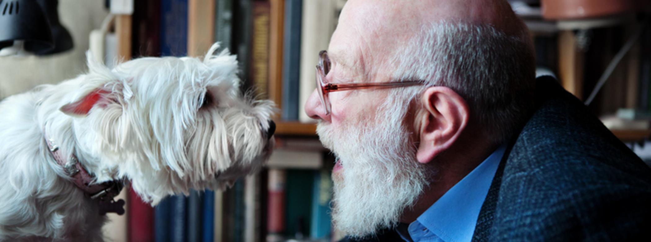 Man and dog staring at each other