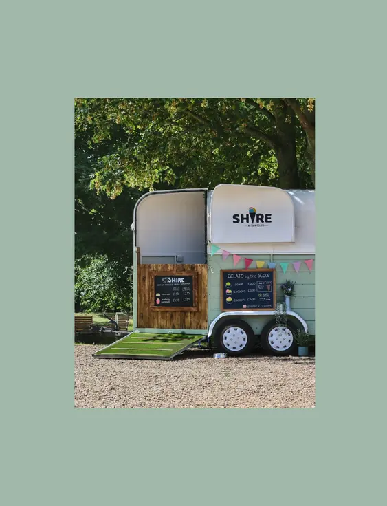 A picturesque county scene with a horse trailer converted into an ice-cream stall.