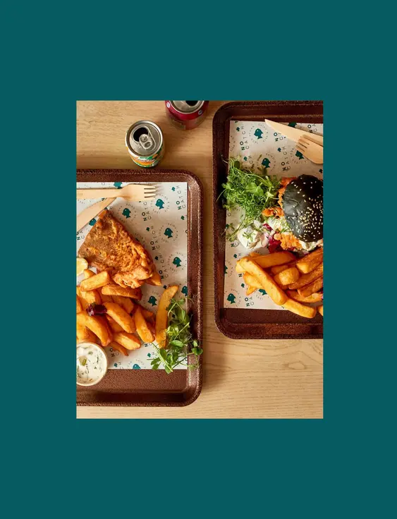 wooden trays with vegan fish and chips on them