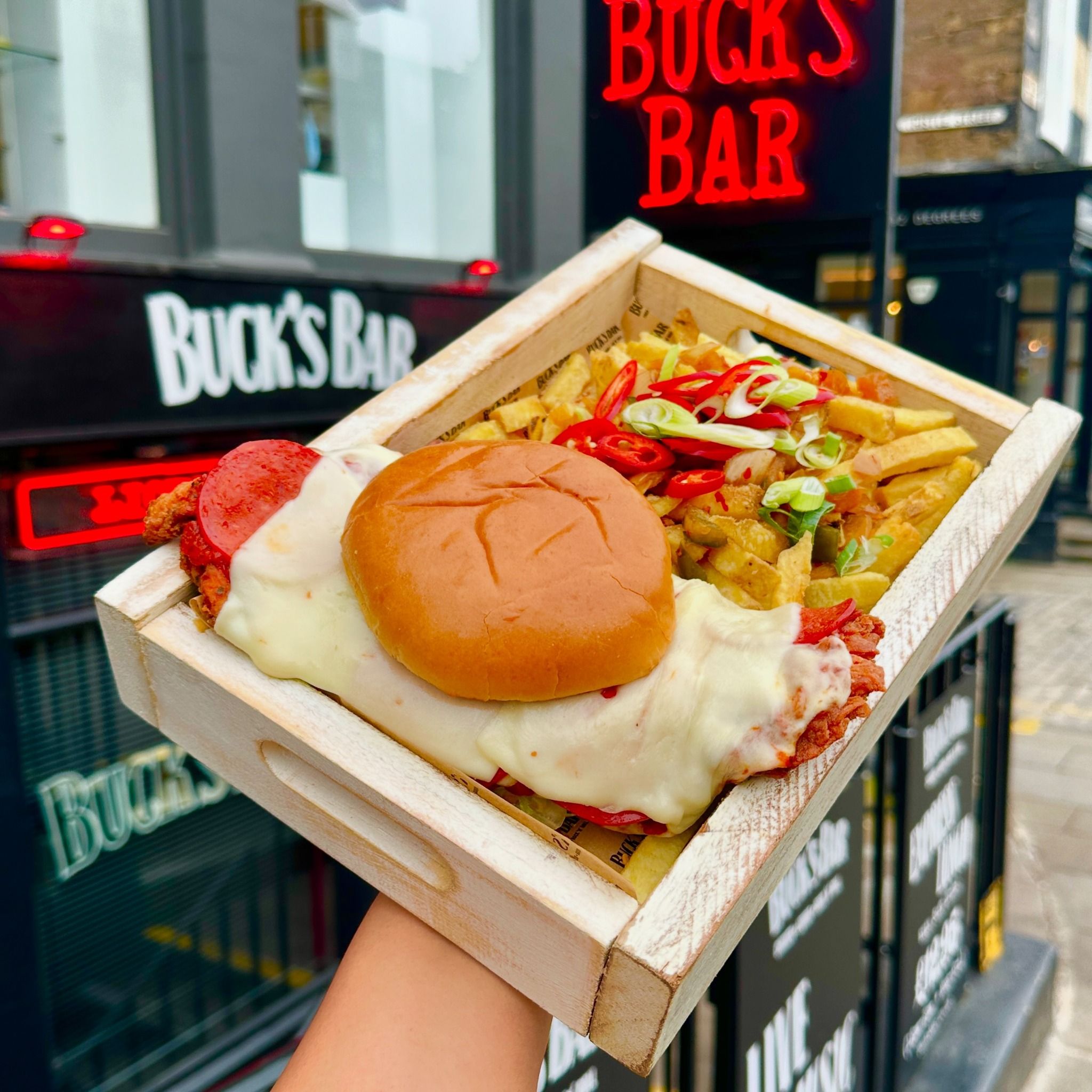 Image of a burger and fries outside of Buck's Bar, Glasgow