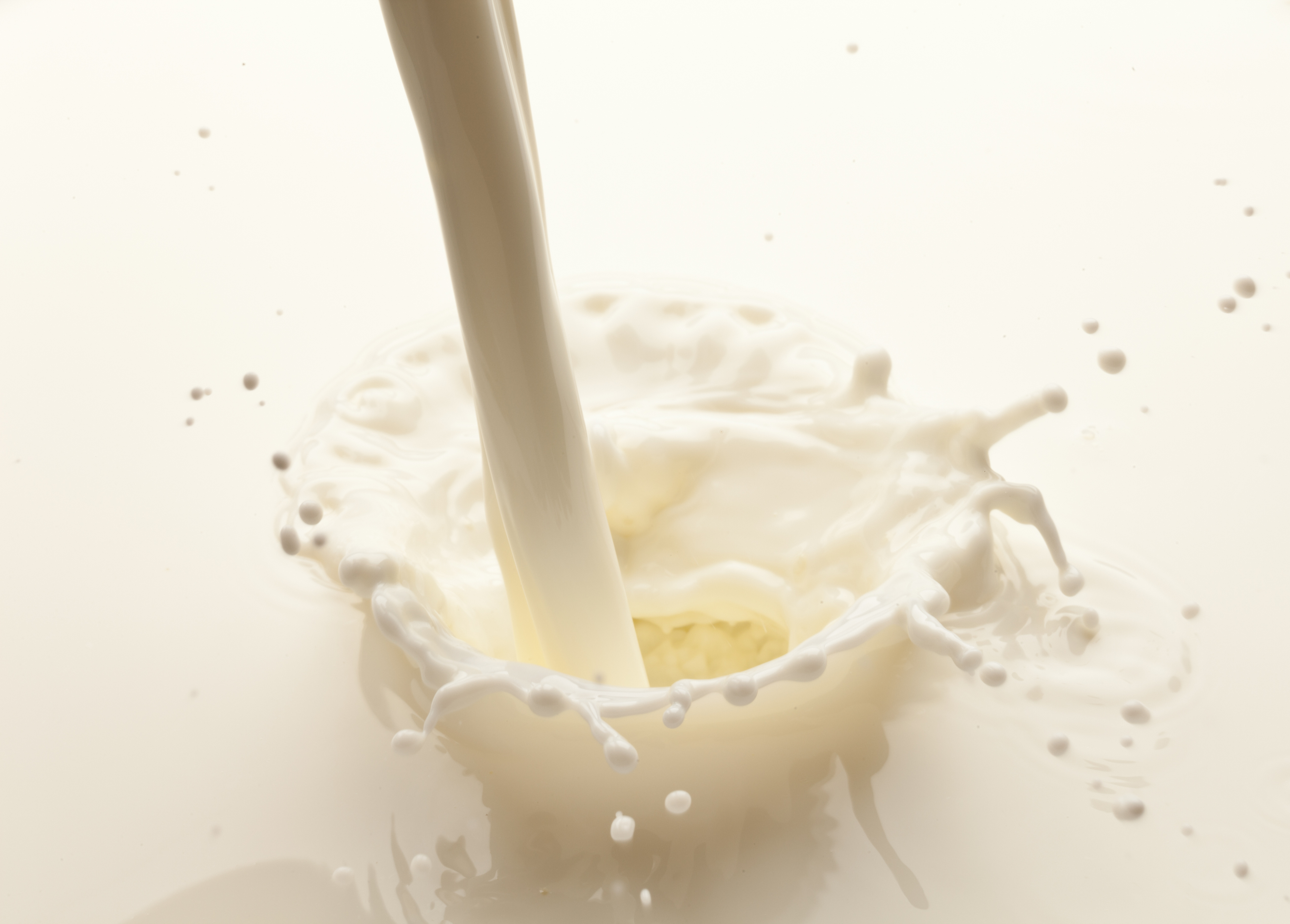 A close-up of milk being poured
