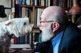 Man and dog staring at each other