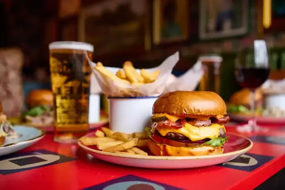 Image of a burger, chips and a beer at Portello Lounge, Nottingham