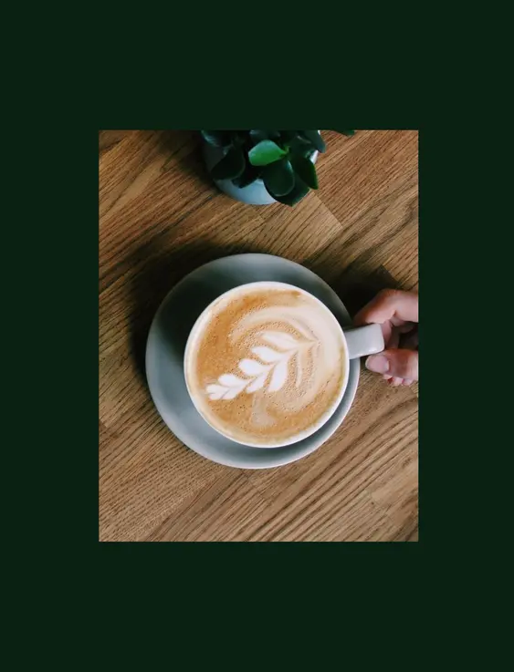 Top down view of someone grabbing a coffee and another person pouring a tea.