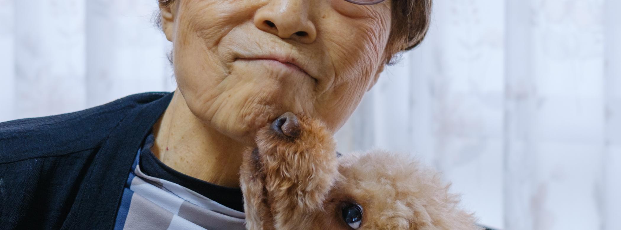 Image of an older woman with a dog