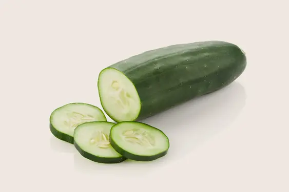 Cucumber on beige background