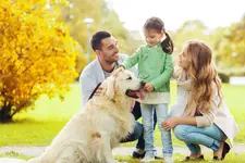 A family with a Golden Retriever